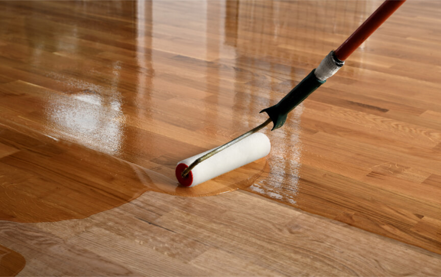 Cleaning and polishing a wooden floor